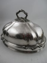 Various items of silver plate including a large ornate meat cover, an American silver jug, an oval