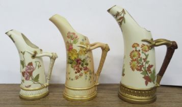 Three Royal Worcester gilt ivory and blush ivory jugs, decorated with flowers, shape No 1116, height