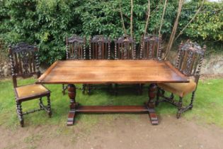 An oak dining table, 72ins x 36ins, height 29ins, together with a set of six carved oak dining