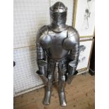 A 20th century suit of armour, with stand, height 63ins