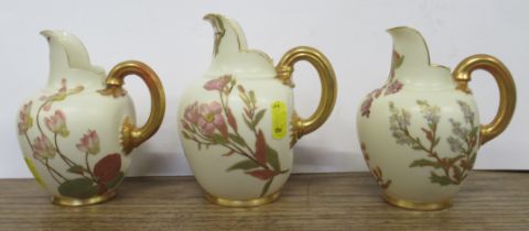 Three Royal Worcester gilded ivory flat back jugs, decorated with shot silk flowers, height 5.