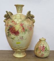 A large damaged Royal Worcester vase, decorated with flowers to a blush ivory ground, with griffin