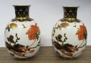 A pair of Derby vases, of bulbous form decorated in iron reds and blues with flowers, height 6.