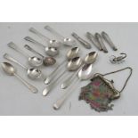 A collection of assorted silver spoons, including Georgian examples, together with a mesh purse