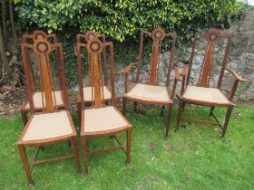 A set of six oak dining chairs, with pewter and ebonized inlay, in the style of George Montague