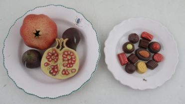 A studio pottery trompe-l'oeil plate, of fruit with pomegranate and figs, diameter 9.5ins,