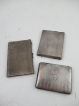 Three hallmarked silver cigarette cases, Birmingham , total weight 16oz