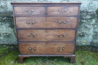 A Georgian mahogany chest, of two short drawers over three graduated long drawers, raised on bracket