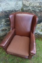 A leatherette upholstered arm chair