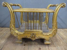 A gilt four division Canterbury in the form of a Regency lyre   22ins wide