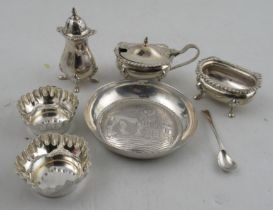 A collection of hallmarked silver cruets and salts together with a silver dish, decorated with a