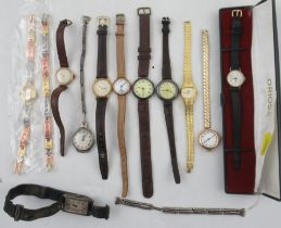A collection of vintage and more modern wrist watches, three with gold cases, some silver