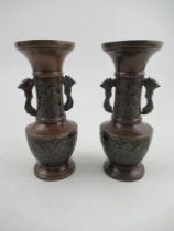 A pair of Japanese style vases, of archaic form, height 6ins