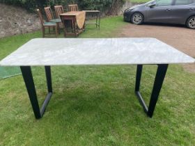 A Camerich carrera marble topped dining table, raised on black ash base, 36ins x 64ins together with