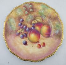 A Royal Worcester cabinet plate, with gilt gadrooned edge, decorated with hand painted fruit, signed