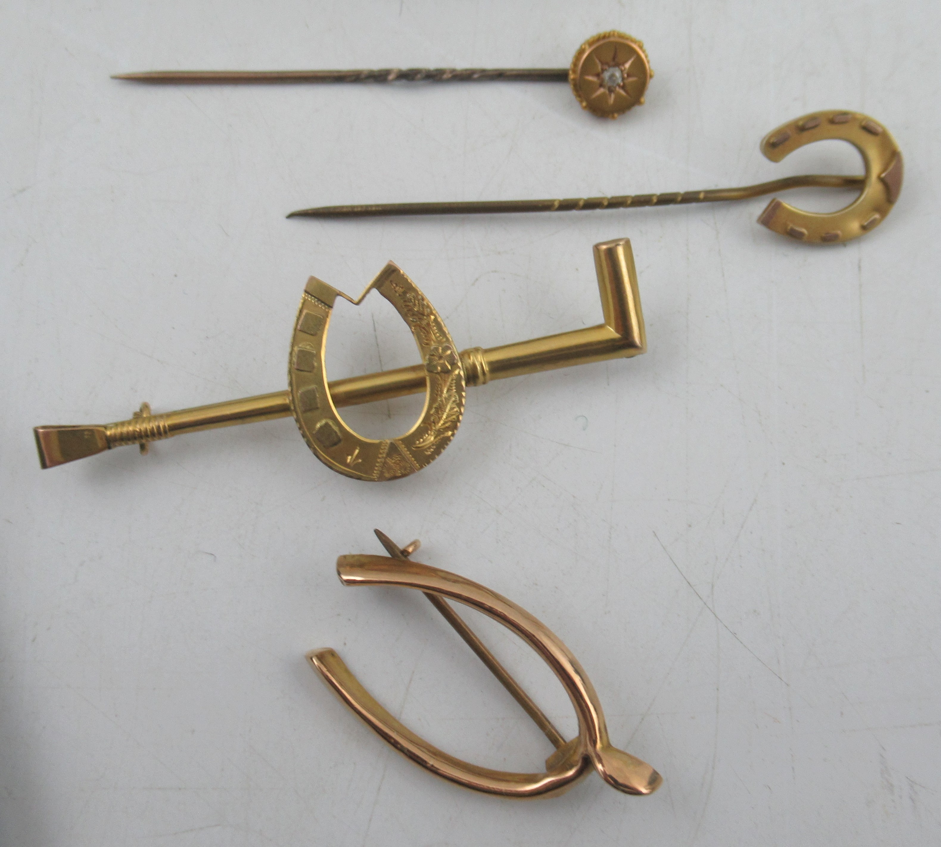 A 15ct gold hunting crop stock pin, together with two brooches and three Victorian stick pins - Image 2 of 5