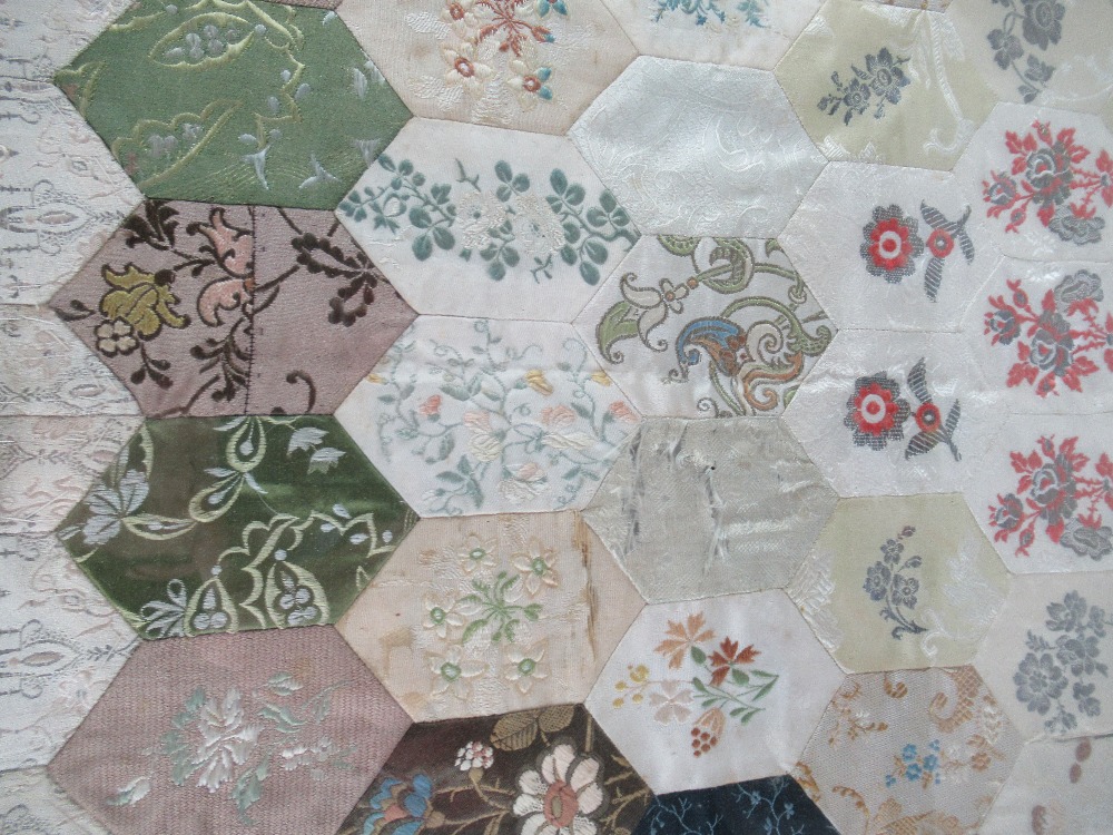 An 18th century patchwork quilt, with a hexagonal design, mounted in a glazed frame - Image 2 of 5