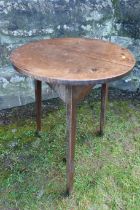 A 19th century circular oak cricket table, diameter 21ins