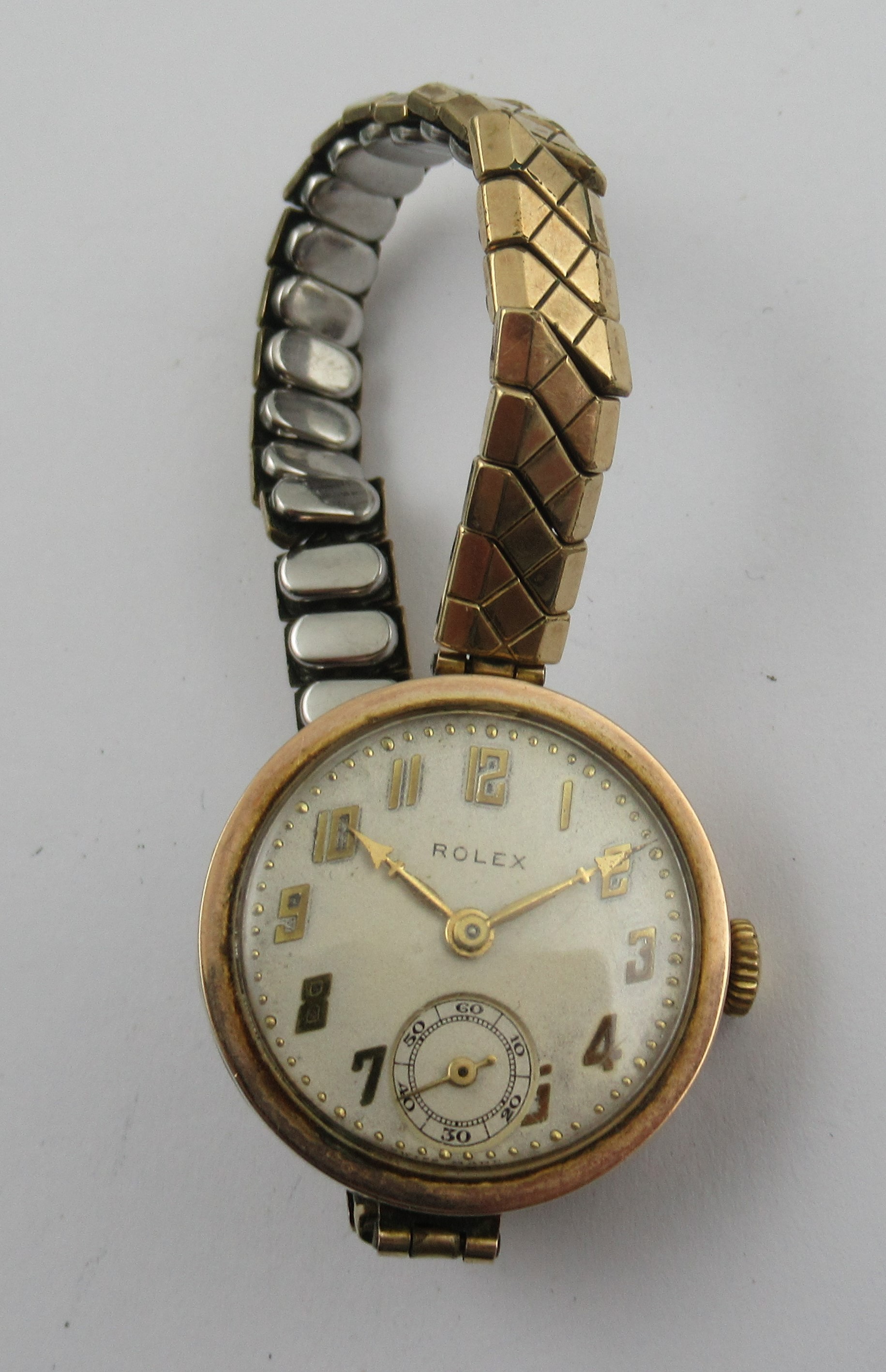 A 9ct vintage Rolex watch, the dial with Arabic numerals and subsidiary seconds dial, on a gilt