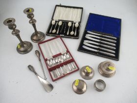 A collection of silver to include a pair of loaded candlesticks, Chester, three inkwells, silver