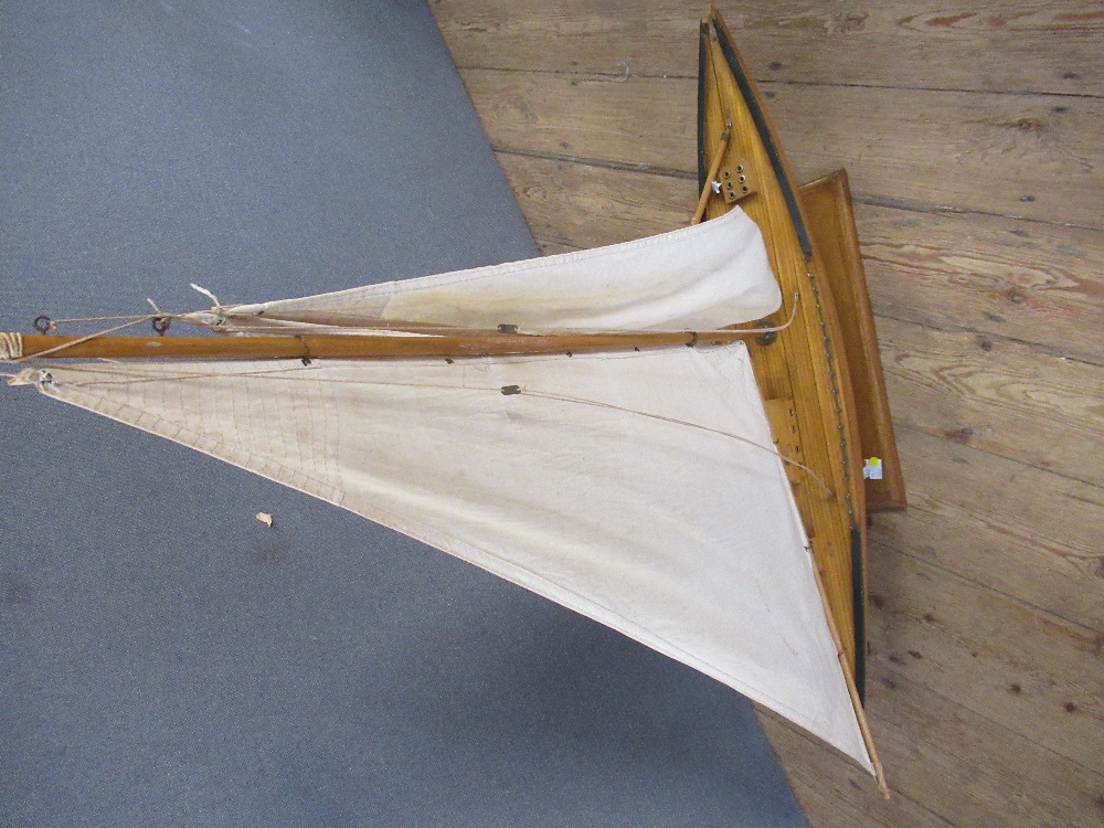 A vintage pond yacht, with stand