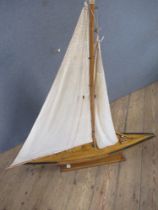 A vintage pond yacht, with stand