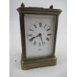 A 19th century French Carriage clock, with roman numerals to the face with key, in working order