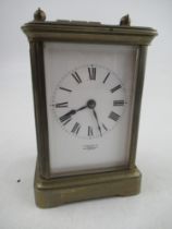 A 19th century French Carriage clock, with roman numerals to the face with key, in working order