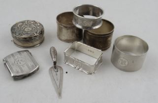 A collection of silver to include vesta case, book mark, napkin rings etc