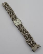 A silver Tissot watch, the square dial with baton/Roman numerals, on link bracelet, stamped '925' '