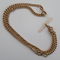 A 9ct rose gold graduated curb link watch chain, with T bar, hallmarked and stamped 'LW & G', weight