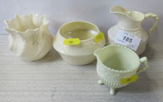 Three pieces of Belleek, together with a similar jug