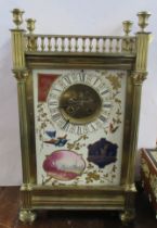 A 19th century French brass mantel clock, the enamel face decorated with birds and panels, of a