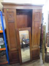 An Edwardian mirror door wardrobe