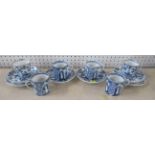 A pair of blue and white onion pattern trio's, together with four coffee cans and two saucers