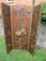 A three fold screen decorated with ribbons,  floral sprays and script, af,