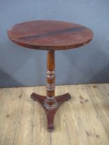 A 19th century mahogany occasional table, raised on turned column , terminating in triform base,