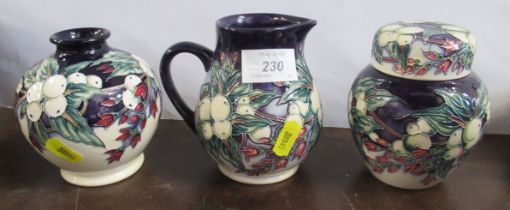 A Moorcroft vase, jug and ginger jar, all decorated in the 'Snowberry pattern' heights 5ins