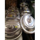 A collection of silver plated entree dishes