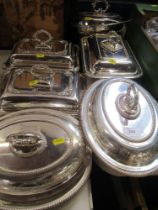 A collection of silver plated entree dishes