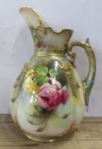 A Royal Worcester Hadley jug, decorated with roses, damage to the handle, height 10ins