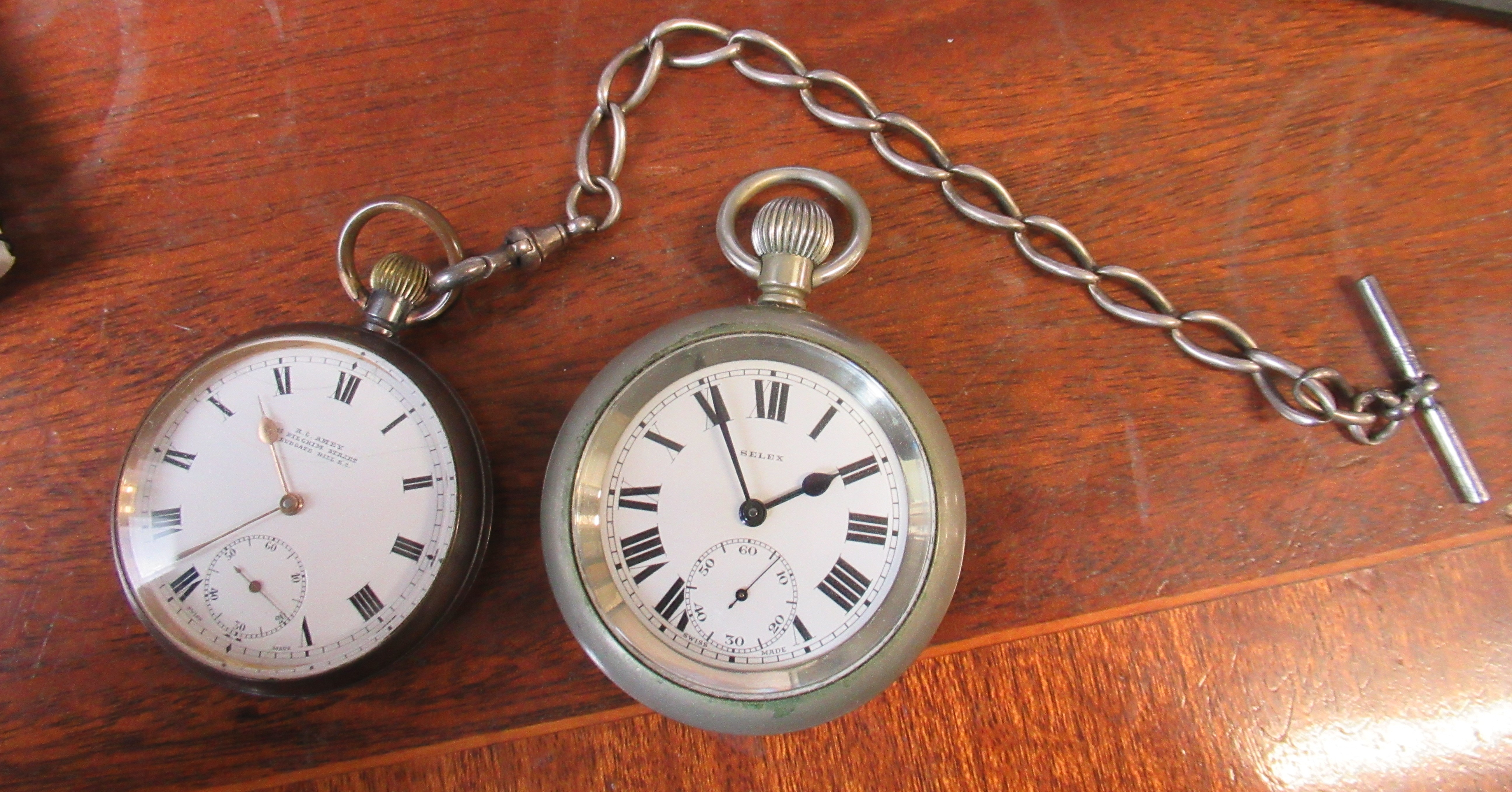 An Omega pocket watch, together with a Selek pocket watch, engraved L.N.E.R 5419 and a watch chain