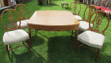 An oak dining table, with carved frieze and legs, 45.5ins x 52ins, height 29ins, together with a set