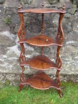 A Victorian walnut four tier whatnot, height 46.5ins