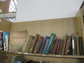 A shelf of books including Italian examples