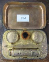A travelling inkwell, with two ink pots and a wax holder