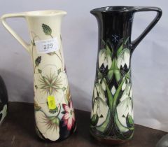 Two Moorcroft jugs, decorated in the 'Bramble revisited' and 'Winter Cascade' patterns, height 9.