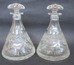 A pair of conical shaped glass decanters and stoppers, height 9.75ins