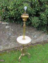 An ornate 19th century gilt metal standard lamp, with scroll decoration,  with marble plinth, over