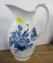 A Royal Copenhagen jug, decorated with flowers, height 8ins